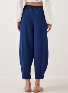 Back view of navy wide-leg pants with elastic waist and vertical stitching detail