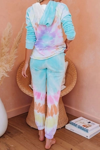 Rear view of a model wearing a pastel tie-dye loungewear set with hoodie and joggers