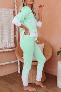Cozy mint green and white color-block loungewear set in a warm home interior setting