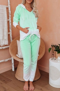 Detail of mint green gradient tracksuit with drawstring hoodie and jogger pants