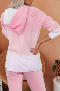 Rear view of velvet lounge set showing pink hooded sweatshirt and matching long pants