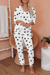 Women's lounge set featuring black star print hoodie and matching drawstring joggers