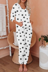 Detail of hooded pajama set with black star prints and functional drawstring waist