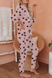 Detailed view of pink heart-patterned lounge set with hoodie and drawstring joggers