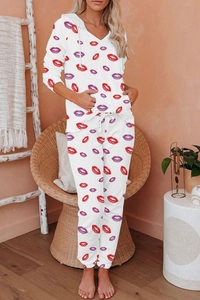 Detail of white two-piece loungewear with red lip print and cozy hoodie drawstring design