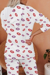 Back view of a white hooded lounge set with red and purple lip prints and loose fit