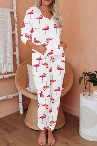 Detail of white knit lounge set with pink flamingo print, hood and drawstring features