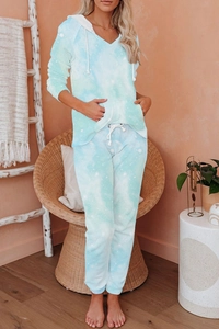 Detail of blue tie-dye hooded pajama set featuring soft fleece fabric and front pocket