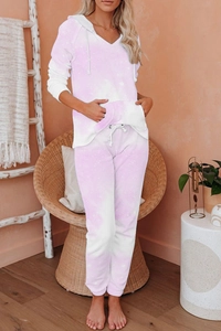 Close-up of soft purple tie-dye knit pajamas with kangaroo pocket and star pattern detail