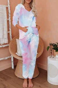 Detail of pink and blue tie-dye knit lounge set with drawstring hoodie and cozy fabric