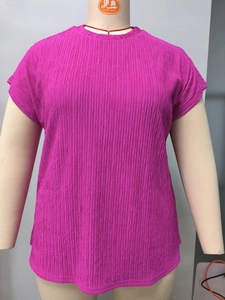 Close-up of vibrant purple pleated fabric texture on a plus size round neck short sleeve tee