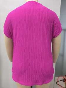 Rear view of bright pink textured pleated short sleeve top with round neck for women