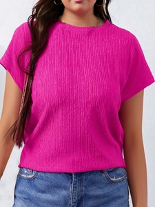 Detail view of the rose pink plissé pleated fabric and crew neck on a summer short sleeve tee