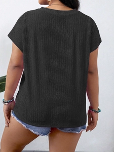 Back view of black round neck T-shirt featuring ruffled texture fabric and short cap sleeves