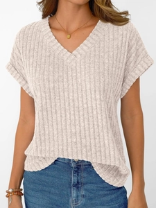 Detail of light grey ribbed knit texture on a casual V-neck t-shirt for women