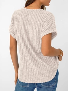 Detail of ribbed knit texture on the short sleeve beige V-neck tee with curved hem
