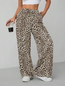 Detail of high-waist leopard print wide-leg pants featuring functional waist drawstring