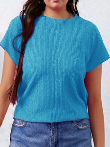 Detail of royal blue textured pleated fabric on a women's round neck summer t-shirt