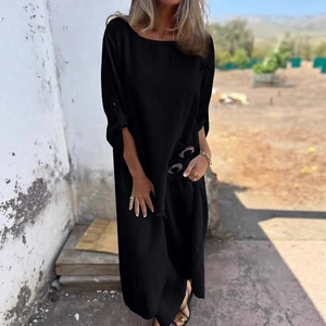 Elegant black long sleeve loose maxi dress featuring decorative side buttons and cuffed sleeves