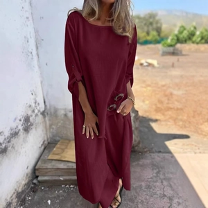 Women's burgundy loose linen dress featuring stylish metal button detail and pockets