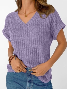 Close-up of purple V-neck knit T-shirt with vertical textures and rolled-up sleeves