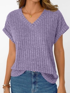 Close-up of purple V-neck short sleeve top in ribbed knit fabric and rolled cuffs