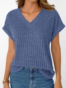 Detail of blue V-neck ribbed knit tee featuring drop shoulder style and soft texture