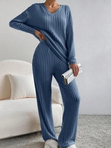 Detailed knit texture of V-neck long sleeve top and wide leg pants in navy blue