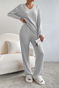 Detailed texture of light grey rib-knit fabric on a casual V-neck lounge set for women