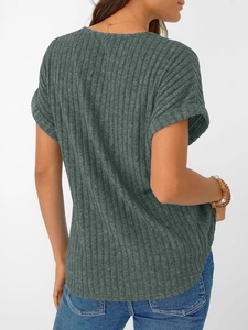 Detail of sage green ribbed V-neck T-shirt with rolled cuff sleeves and soft fabric texture