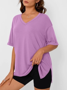 Detail view of purple V-neck t-shirt with rolled sleeves and small side slits