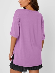 Rear view detail of a lilac V-neck T-shirt showing dropped shoulders and side slits