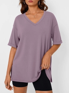 Detail view of V-neck lilac t-shirt showing side slits and soft knitted texture
