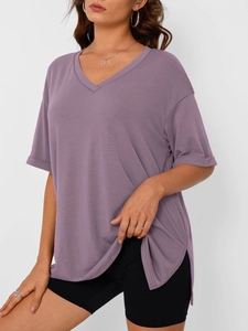 Detail of purple V-neck t-shirt showing soft knit fabric and side slit hem detail