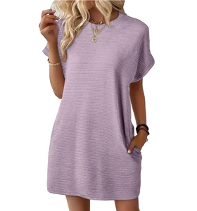 Detail of light purple summer dress showing textured fabric and functional side pocket