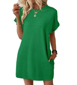 Detail view of emerald green short sleeve dress with round neck and side pockets