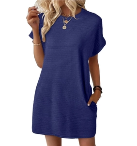 Detail of navy blue short-sleeve dress showing textured fabric and side pockets