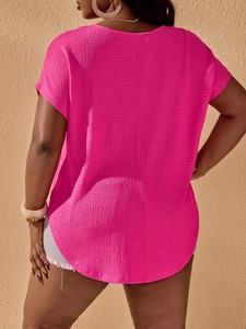 Back view of rose red short sleeve T-shirt with textured fabric and curved hem