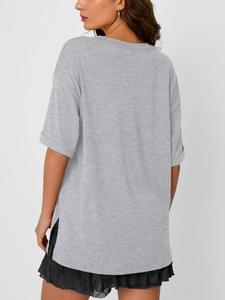 Detail view of the gray V-neck T-shirt featuring side slits and rolled sleeves texture