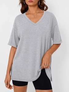 Close-up of the V-neckline and rolled short sleeves on a grey cotton blend t-shirt