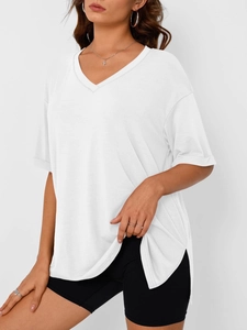 Detail of white V-neck short sleeve top with side slit and loose drop shoulder design