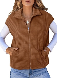 Detailed view of brown waffle knit texture and zipper collar on sleeveless vest