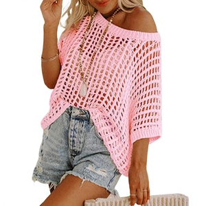 Summer pink hollow crochet knit sweater top for women paired with denim shorts