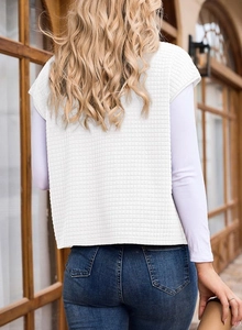Rear view of a white waffle textured oversized sleeveless sweatshirt for women vest detail