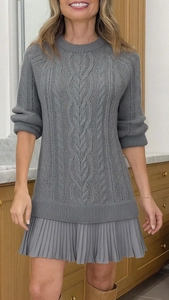 Detailed view of grey cable knit texture combined with pleated chiffon mini dress hem