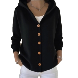 Detail of light-colored wooden buttons on a black hooded knitted cardigan for women