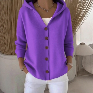 Women's purple hooded knitted cardigan with buttons in a stylish minimalist setting