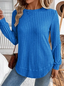 Detail of blue ribbed knit top showing vertical texture and crew neck design