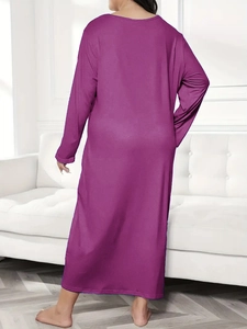 Back view of a loose purple long-sleeved maxi sleepwear dress with drop shoulder detail