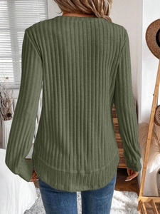 Detailed back view of olive green ribbed knit top featuring a curved hem design